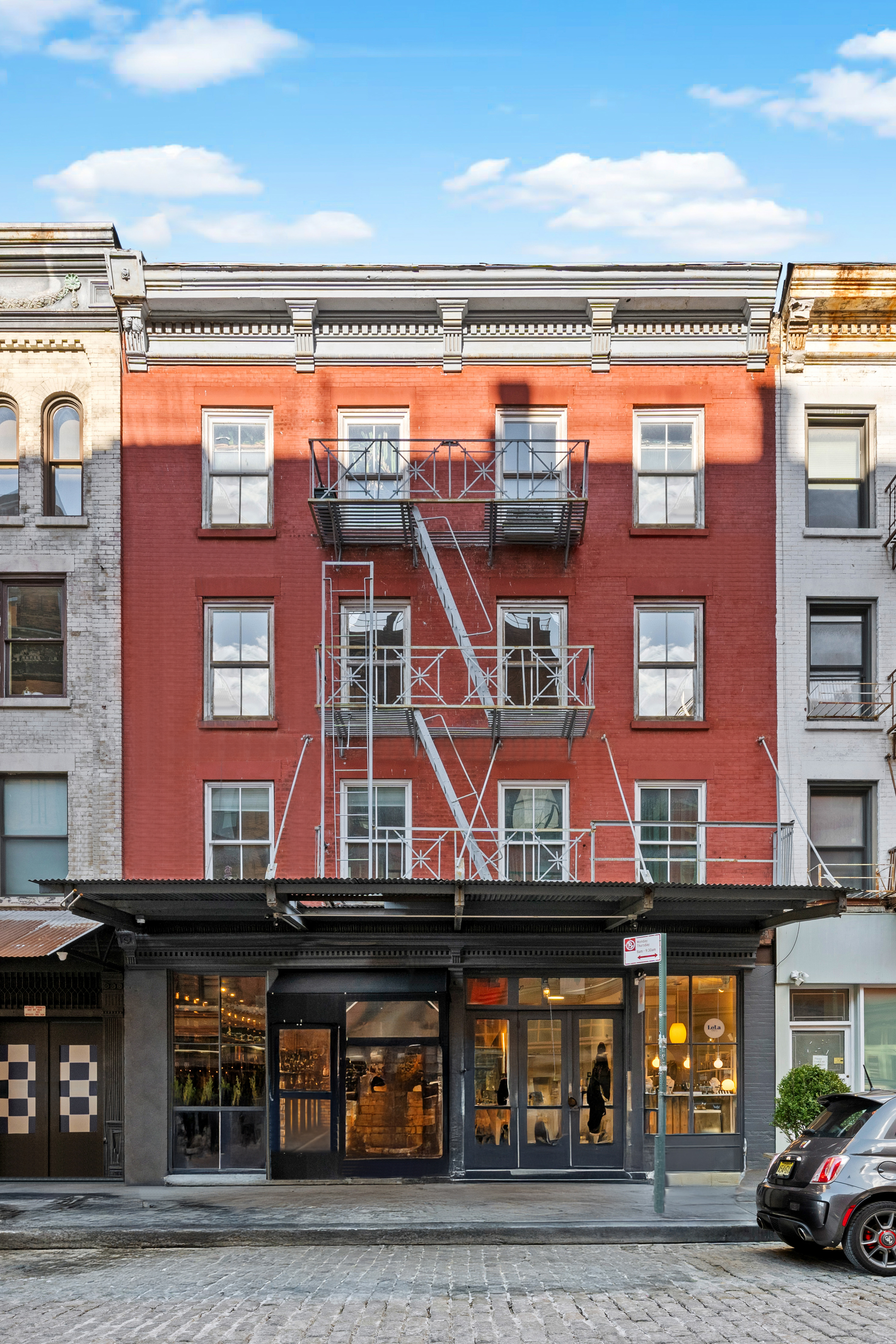24 Harrison Street, Unit 3 Manhattan, NY 10013 - Photo 10 of 11 a view of a building with car windows