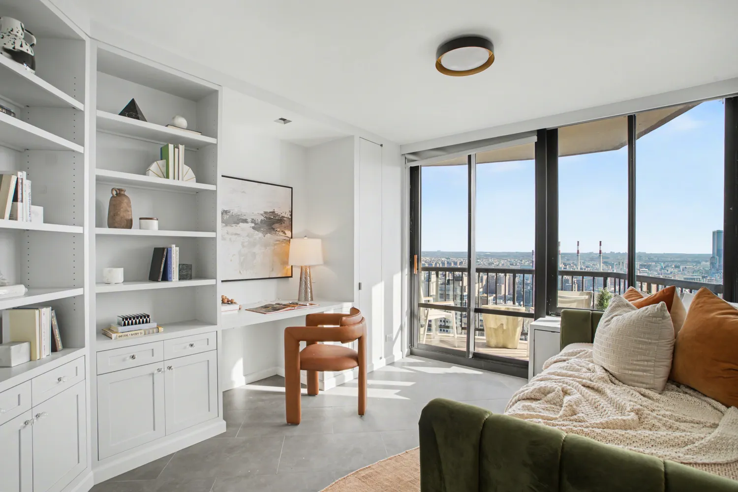 a view of a balcony with two chairs and a table
