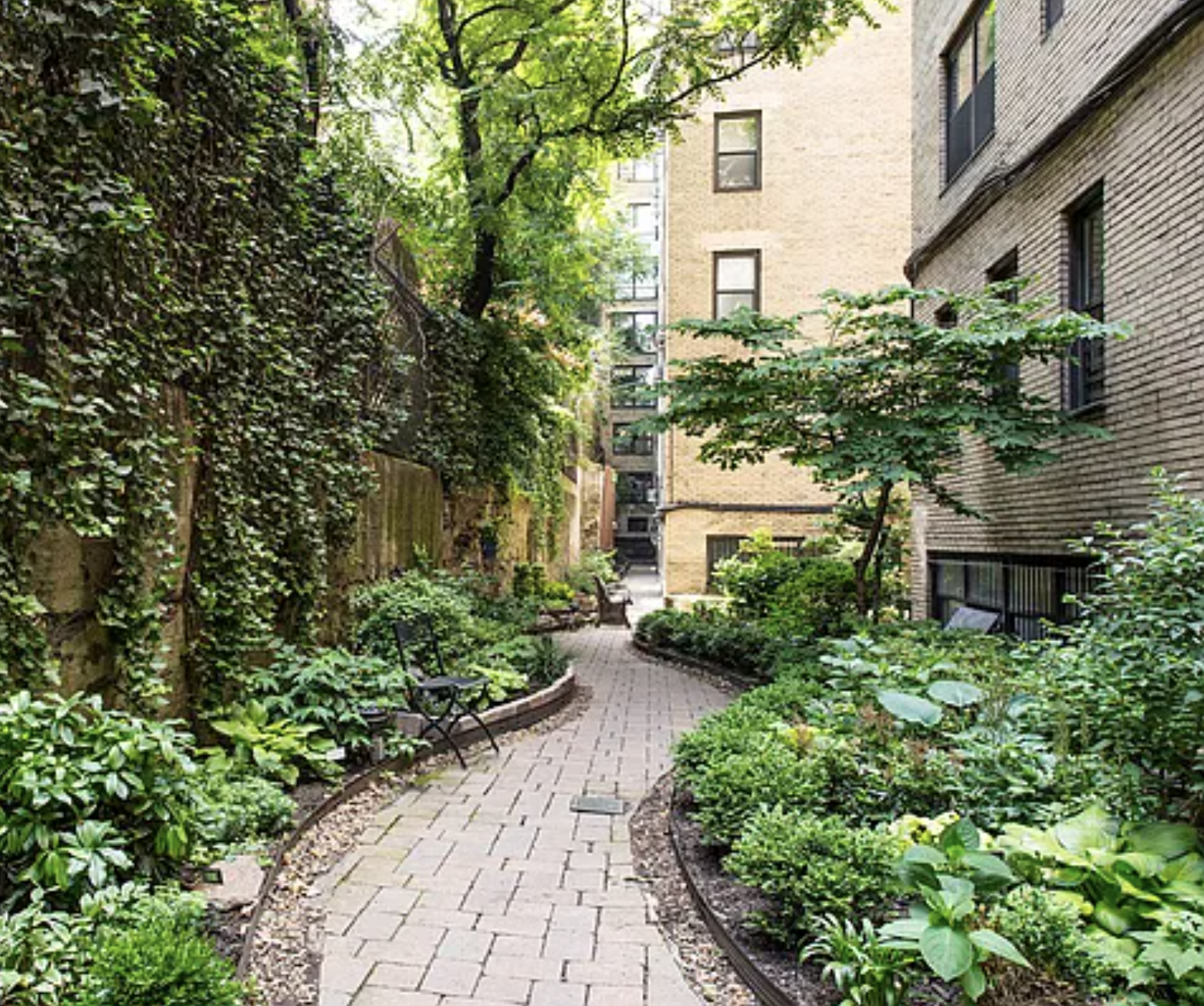 434 East 52nd Street, Unit 1BH Manhattan, NY 10022 - Photo 20 of 23 front view of a house with a yard
