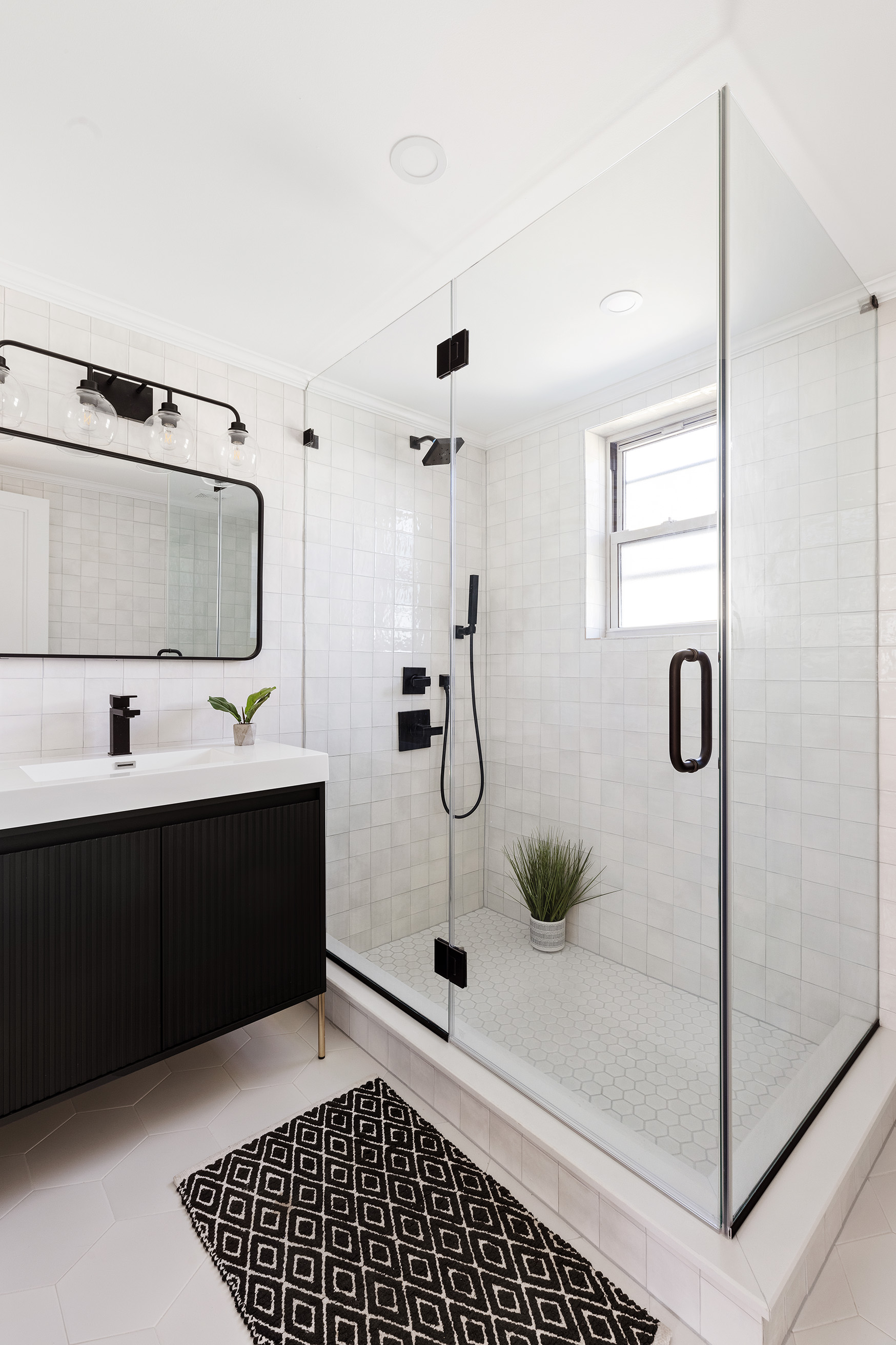 728 Westminster Road, Unit TWNHS Brooklyn, NY 11230 - Photo 20 of 23 a bathroom with a sink and a mirror