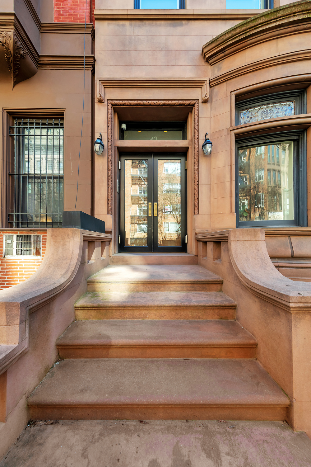 42 West 71st Street Manhattan, NY 10023 - Photo 33 of 35 a living room with a balcony and large windows