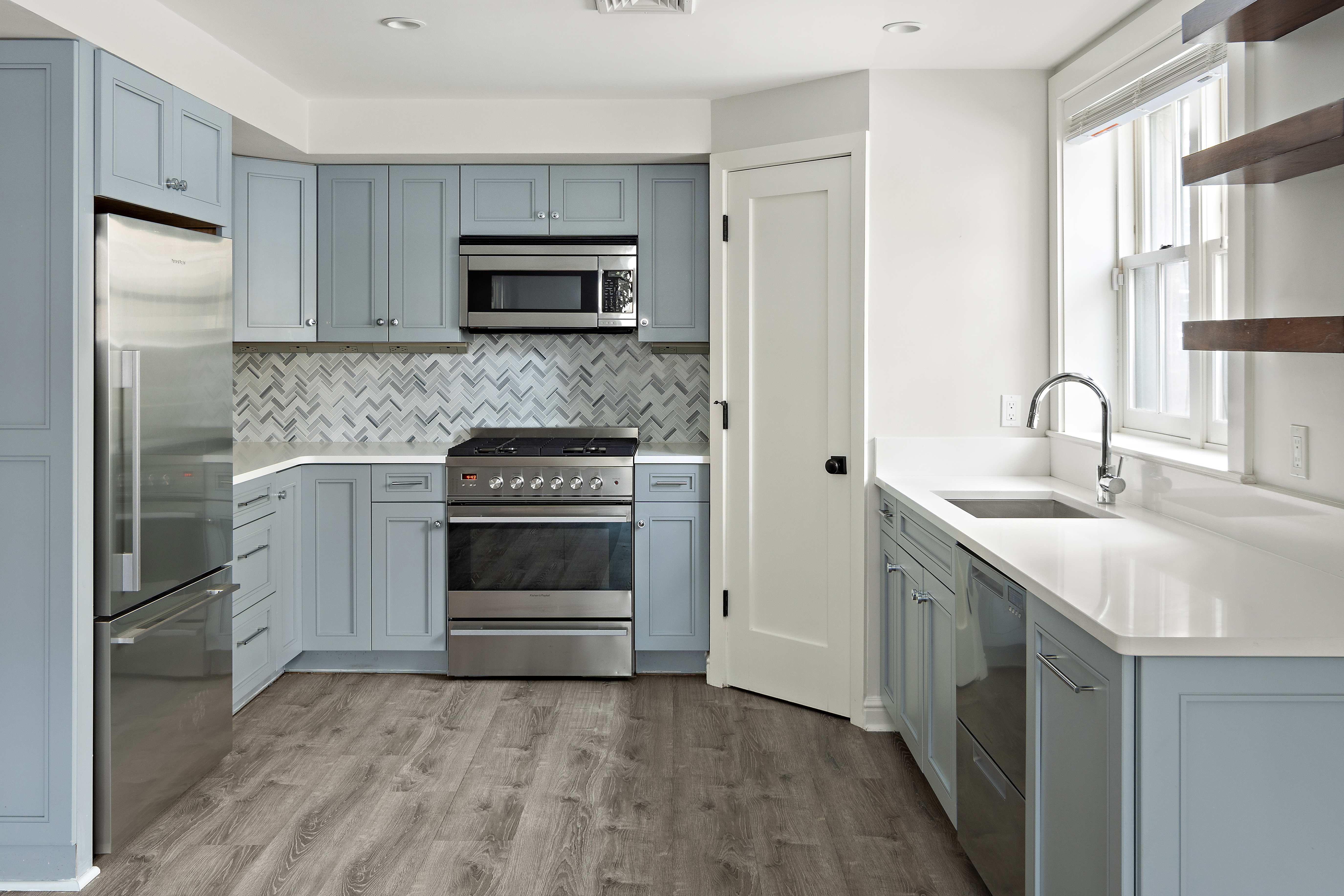 35 Willard Street Cambridge, MA 02138 - Photo 28 of 36 a kitchen with a sink stove and refrigerator