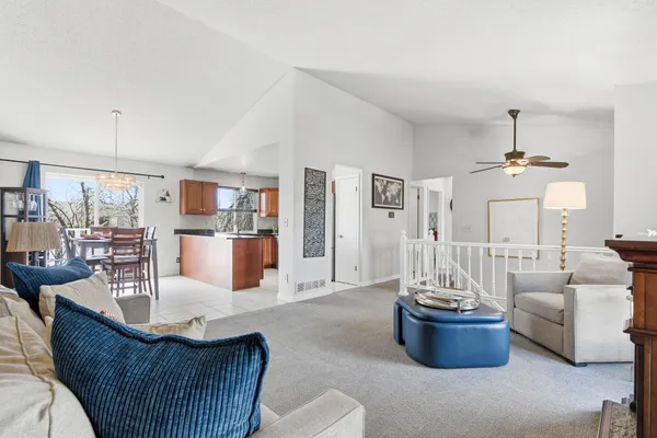 a kitchen with stainless steel appliances granite countertop a stove a sink dishwasher and a refrigerator