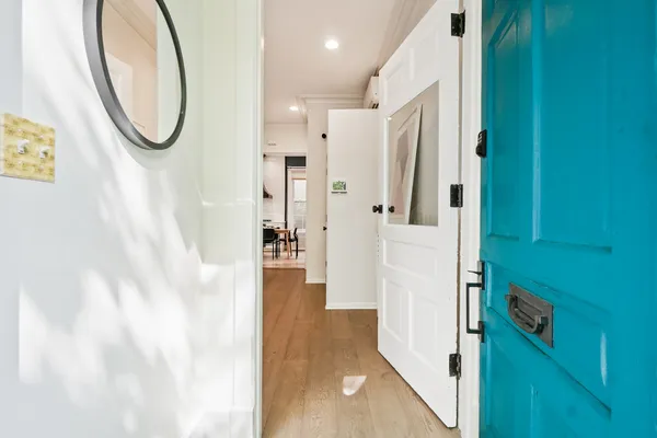 a bathroom with a granite countertop shower and a mirror
