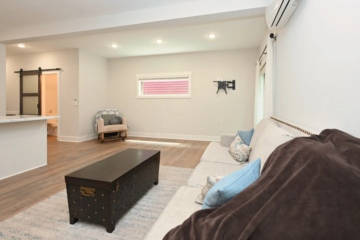 a living room with furniture and a couch