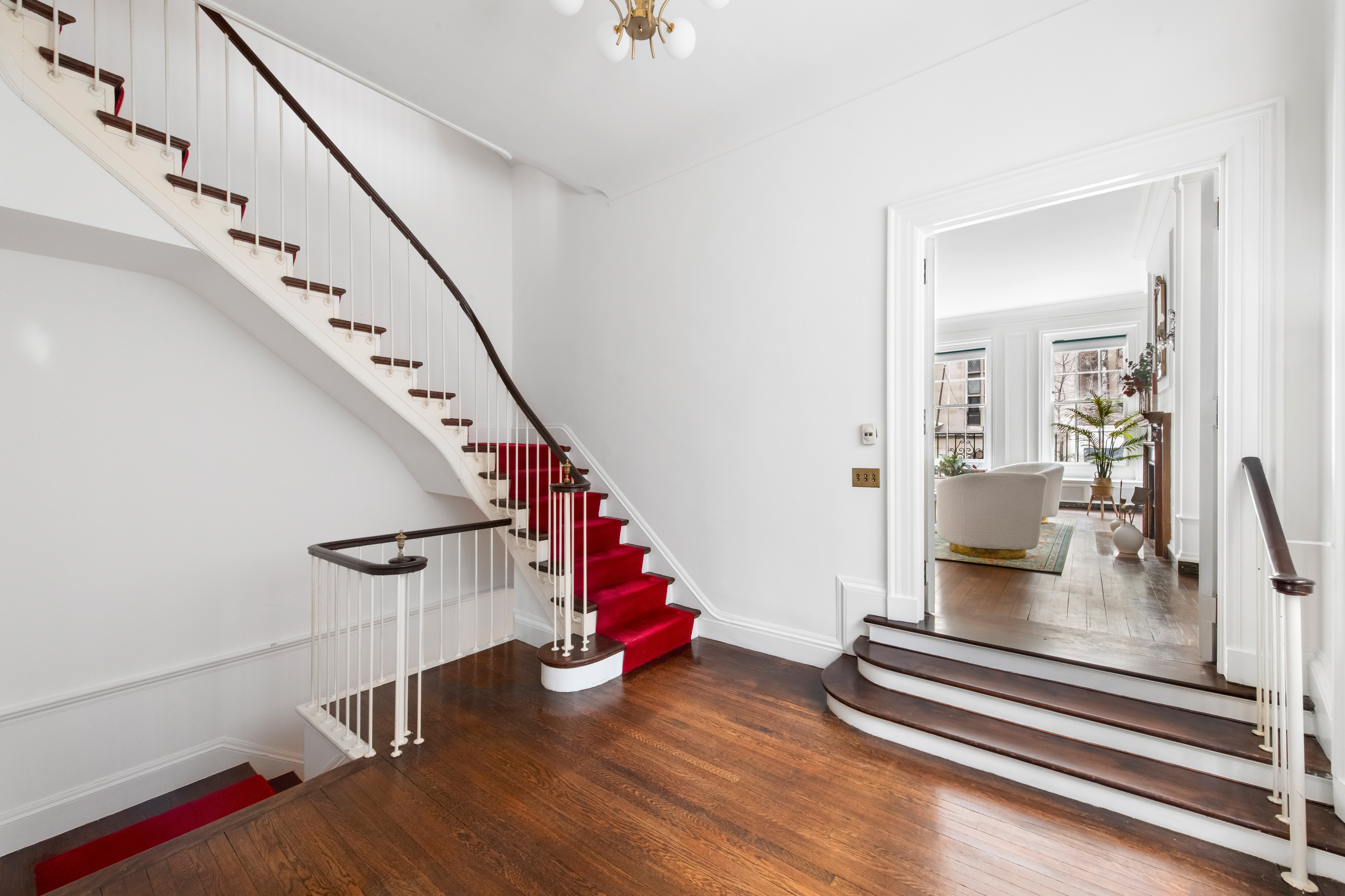 155 East 70th Street Manhattan, NY 10021 - Photo 21 of 27 a view of entryway and hall with wooden floor