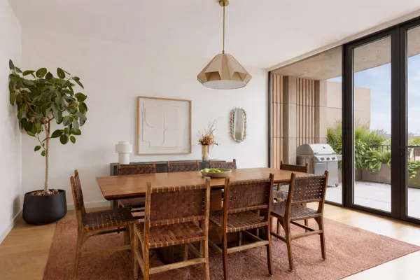 a view of a dining room with furniture window and outside view