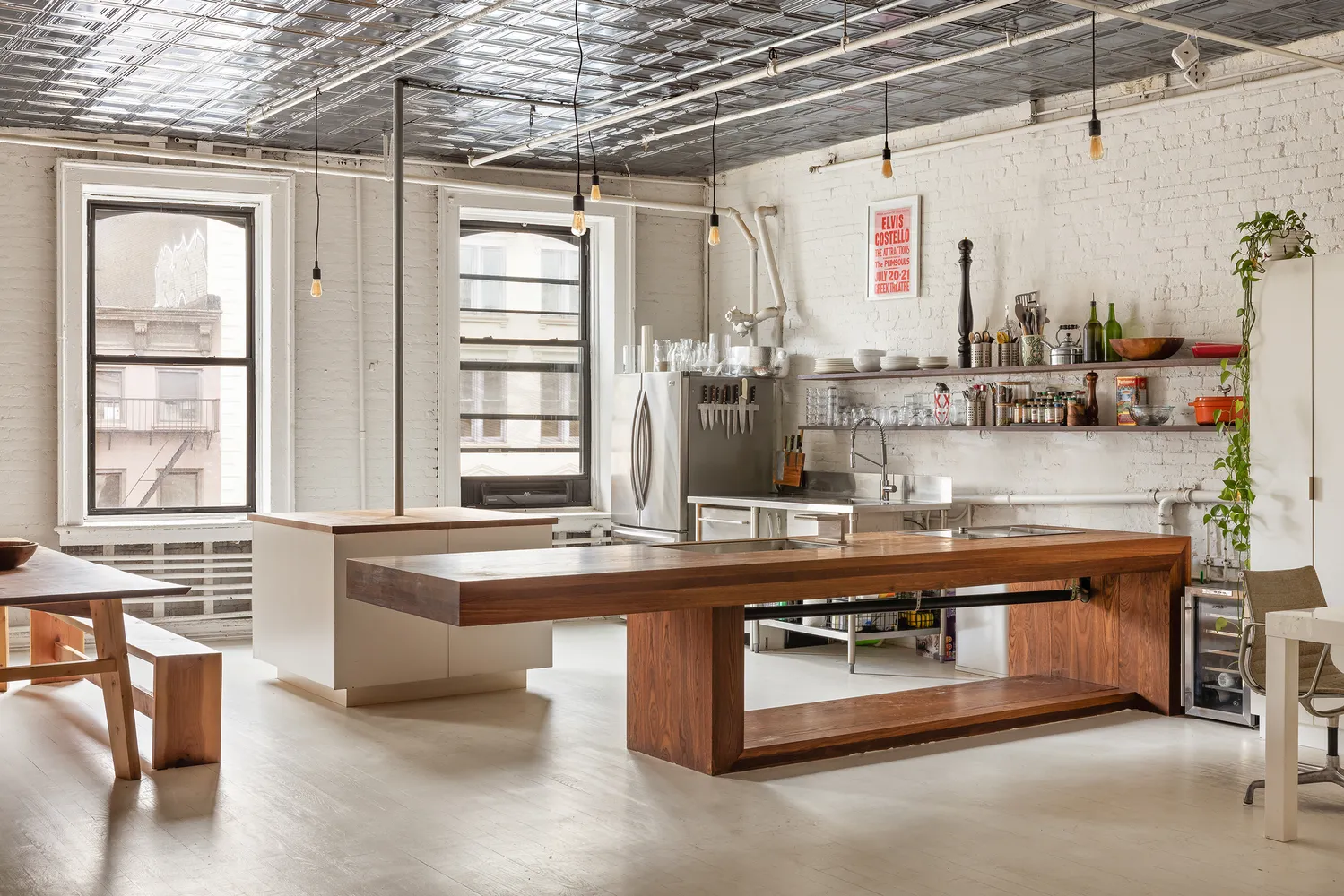 a kitchen with stainless steel appliances granite countertop a sink and wooden cabinets