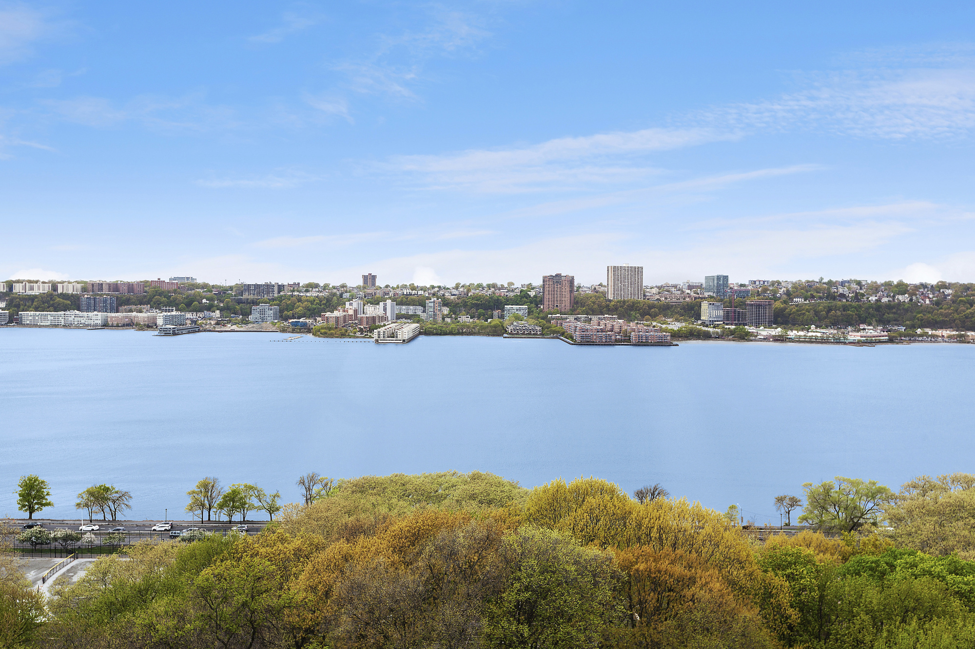 325 Riverside Drive, Unit 111 Manhattan, NY 10025 - Photo 11 of 13 a view of a lake with houses in the back