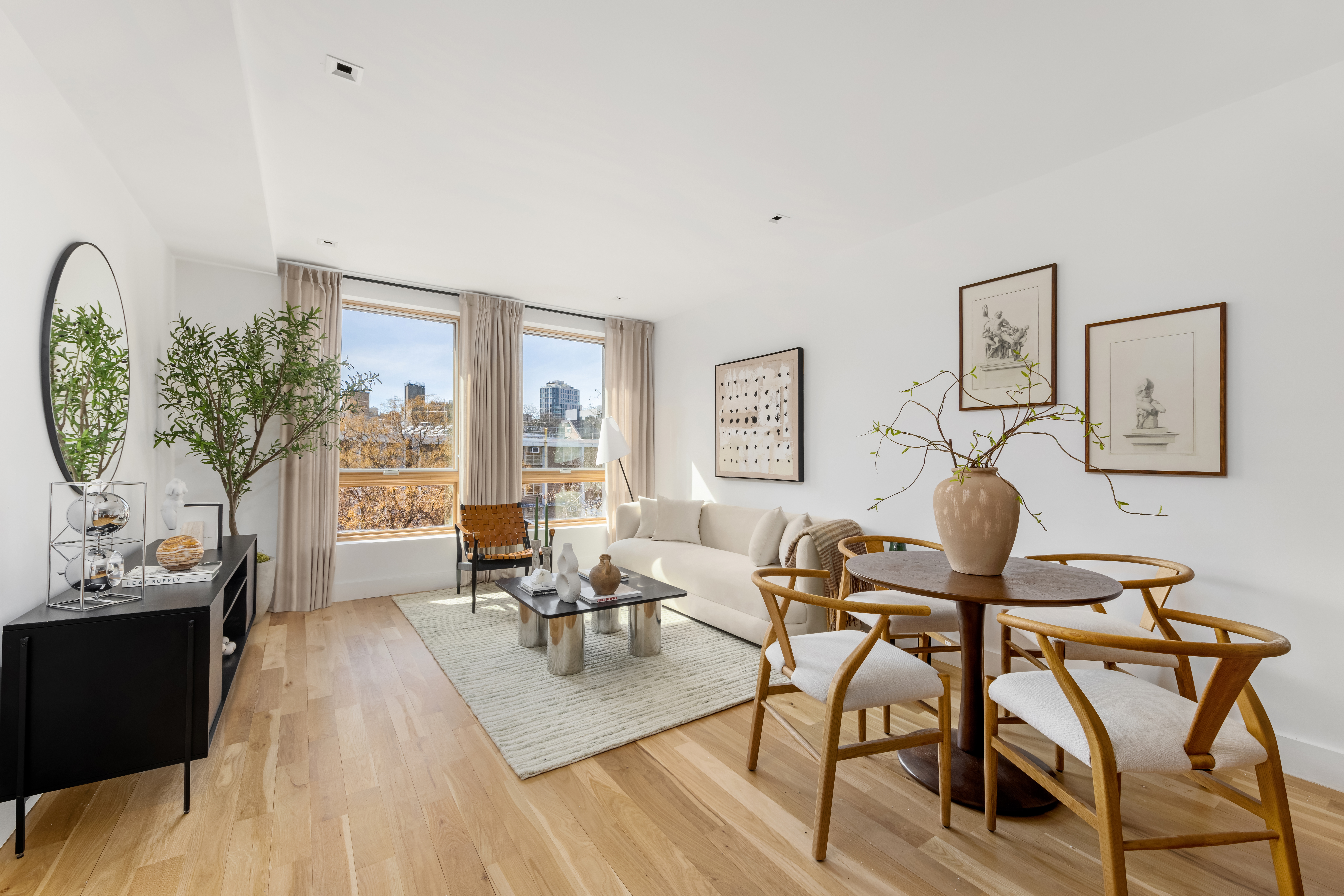 529 Park Place, Unit 401 Brooklyn, NY 11238 - Photo 2 of 13 a living room with furniture and wooden floor