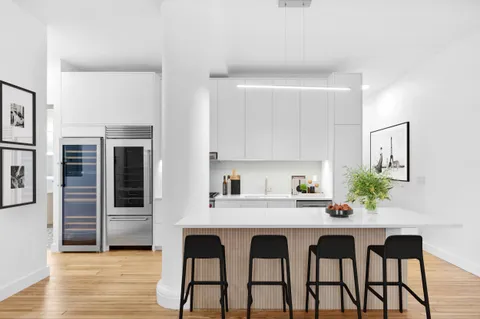 a kitchen with a table and chairs in it