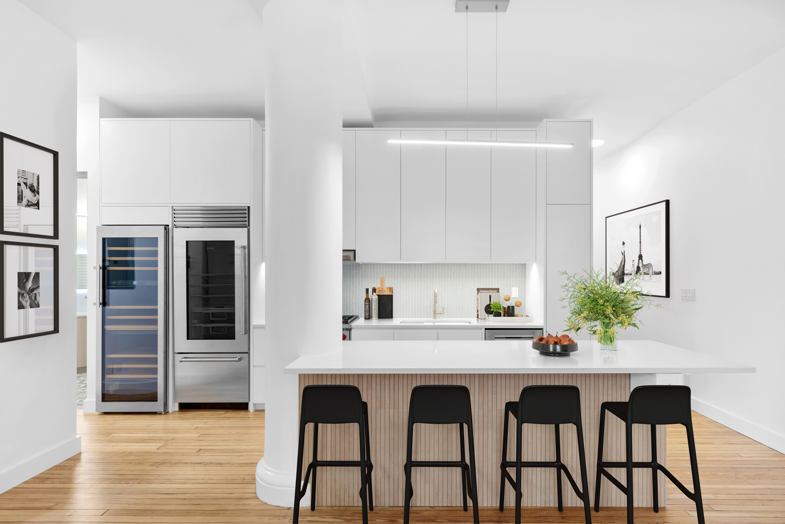 395 Broadway, Unit 5B Manhattan, NY 10013 - Photo 10 of 13 a kitchen with a table and chairs in it