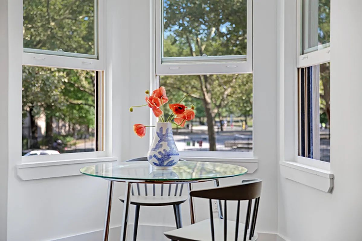 a living room with furniture a couch and wall paintings