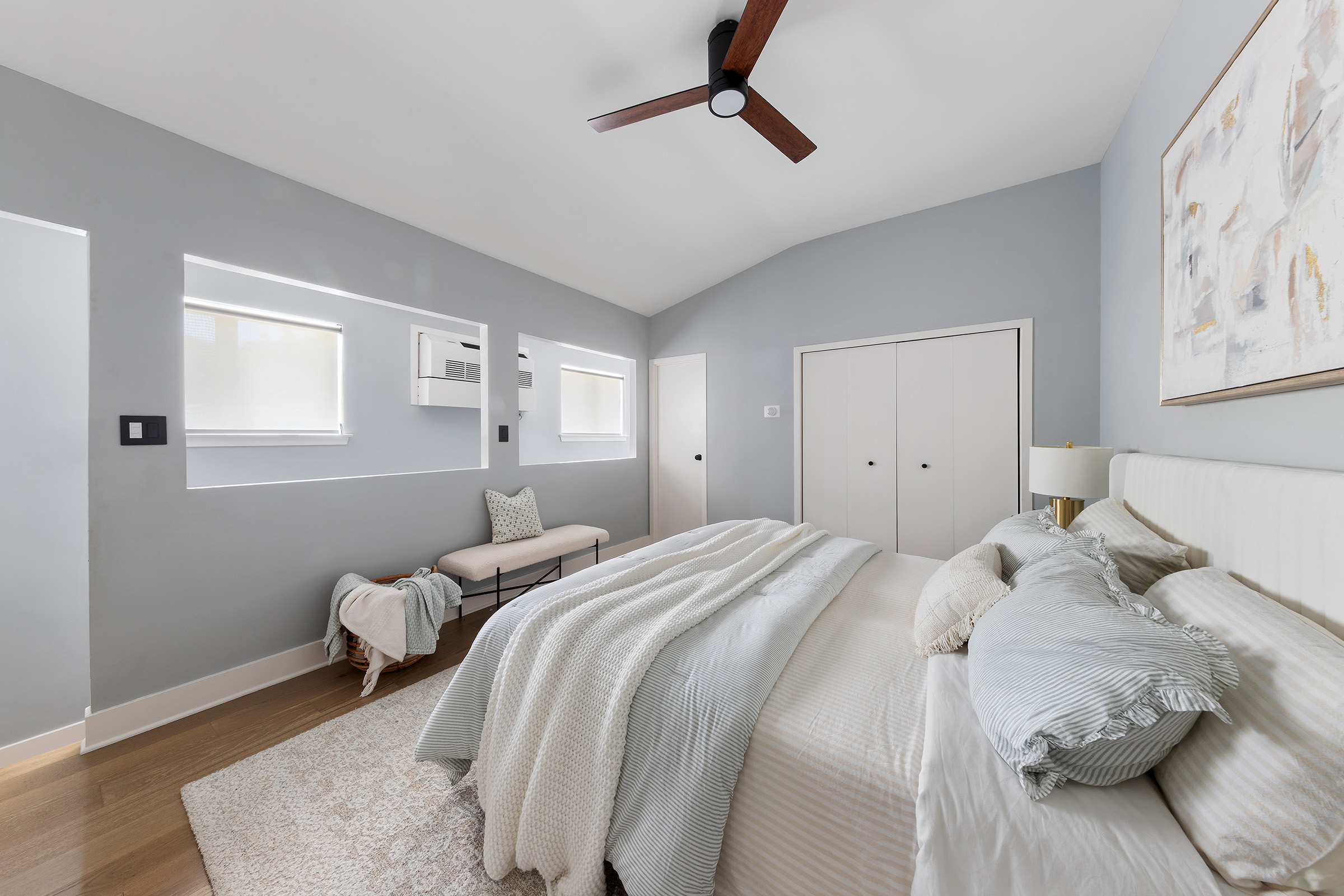 113 Prospect Park Southwest, Unit 12 Brooklyn, NY 11218 - Photo 10 of 13 a bedroom with a bed and wooden floor