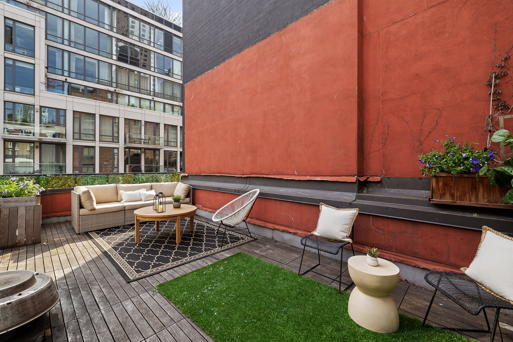a backyard of a house with outdoor seating