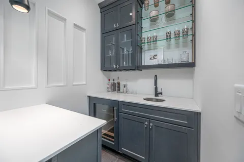 a bathroom with a granite countertop sink mirror and double