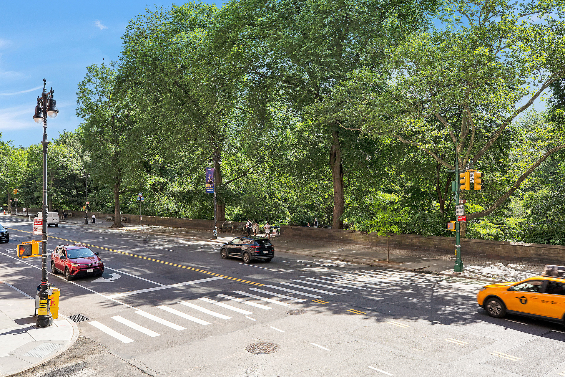 25 Central Park West, Unit 2Q Manhattan, NY 10023 - Photo 11 of 12 a view of a street with cars