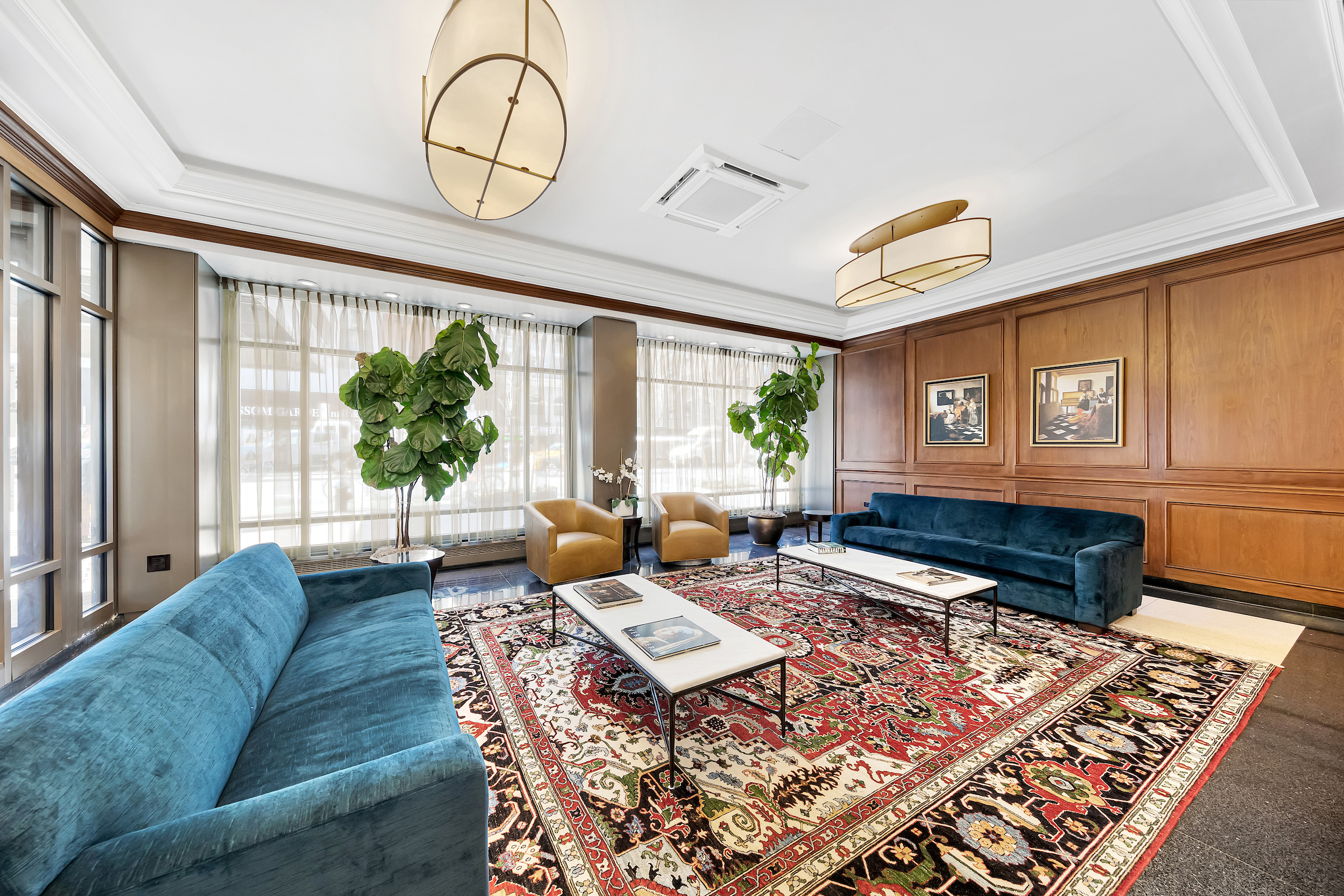 77 7th Avenue, Unit 9E Manhattan, NY 10011 - Photo 7 of 9 a living room with furniture and a rug