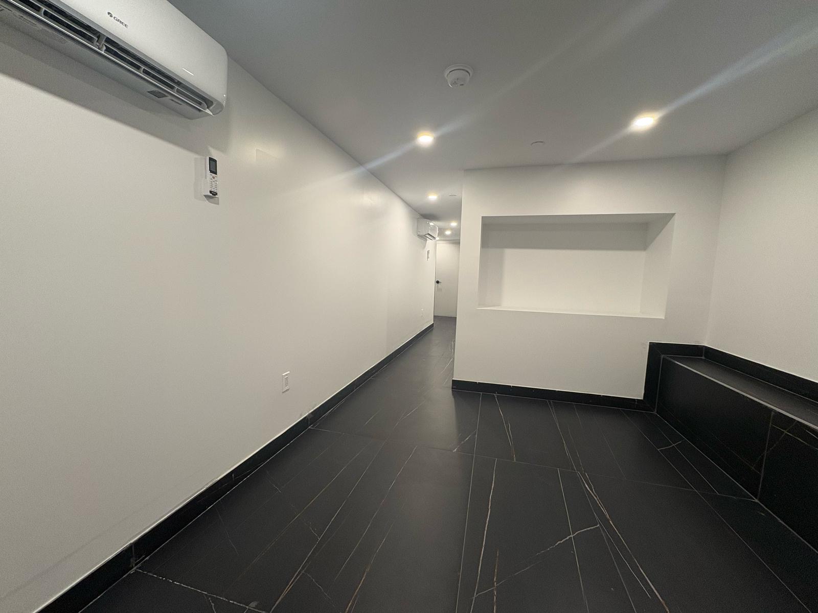 97 Seigel Street, Unit COMM Brooklyn, NY 11206 - Photo 4 of 7 a view of hallway with stairs and wooden floor