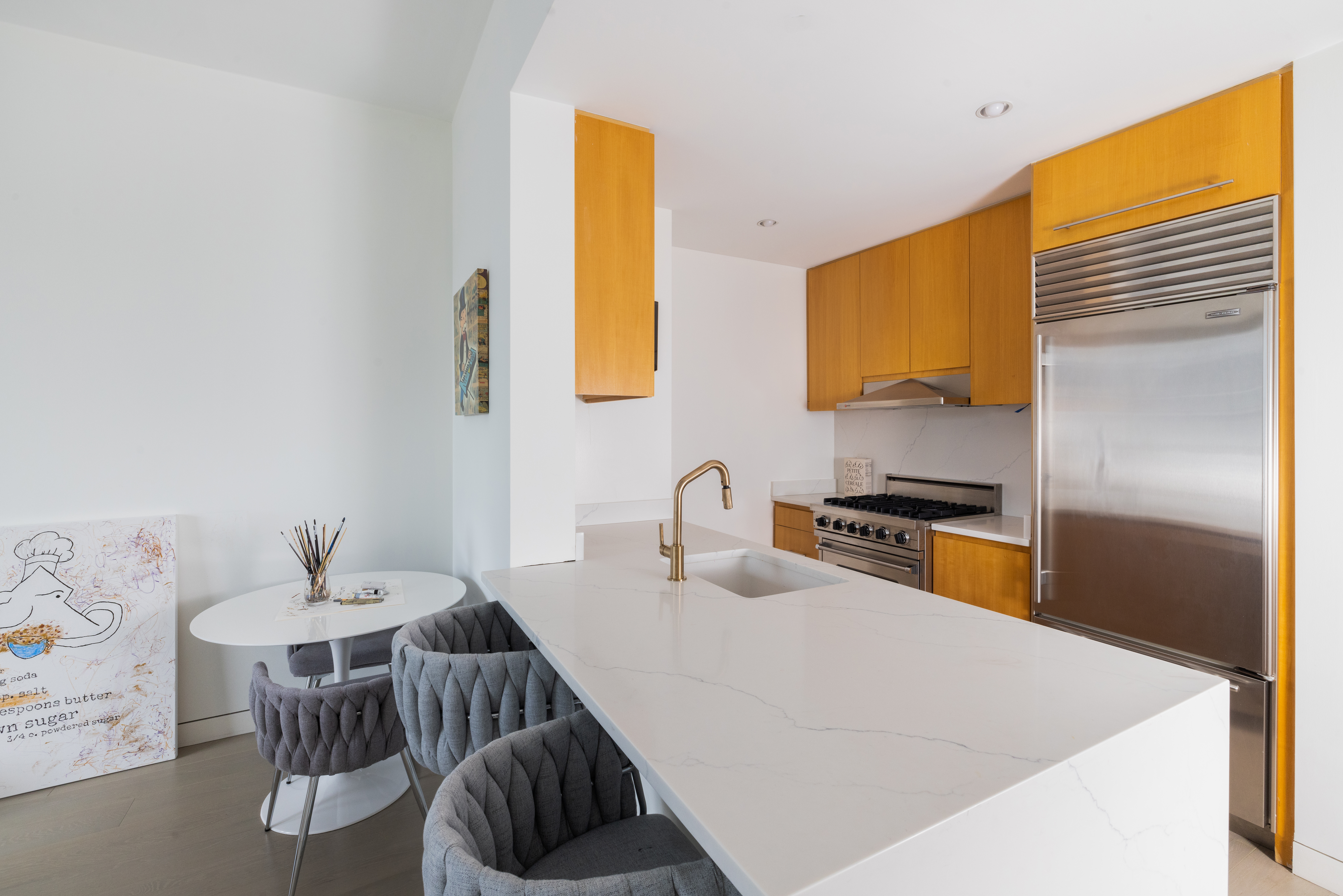 255 Hudson Street, Unit 9C Manhattan, NY 10013 - Photo 5 of 19 a kitchen with a sink cabinets and window