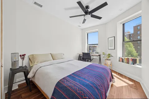 a bed room with a bed and a tv