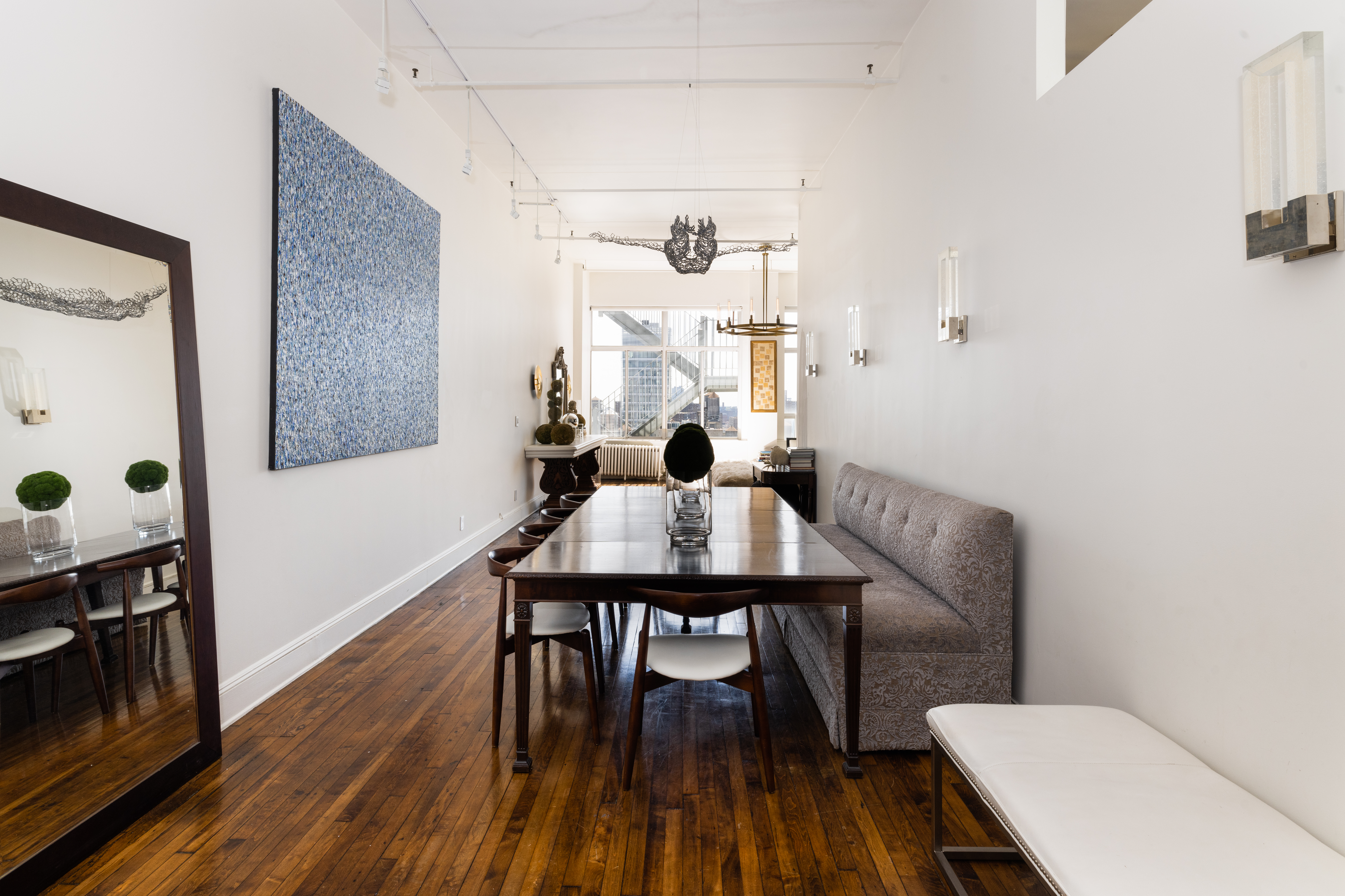 718 Broadway, Unit PHC Manhattan, NY 10003 - Photo 4 of 21 a view of a dining room with furniture and wooden floor