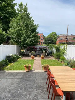 a view of backyard and patio