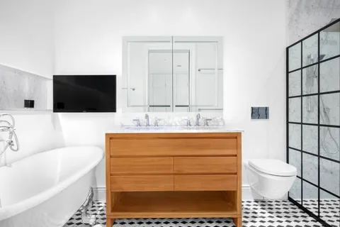 a bathroom with a sink a toilet and a bathtub