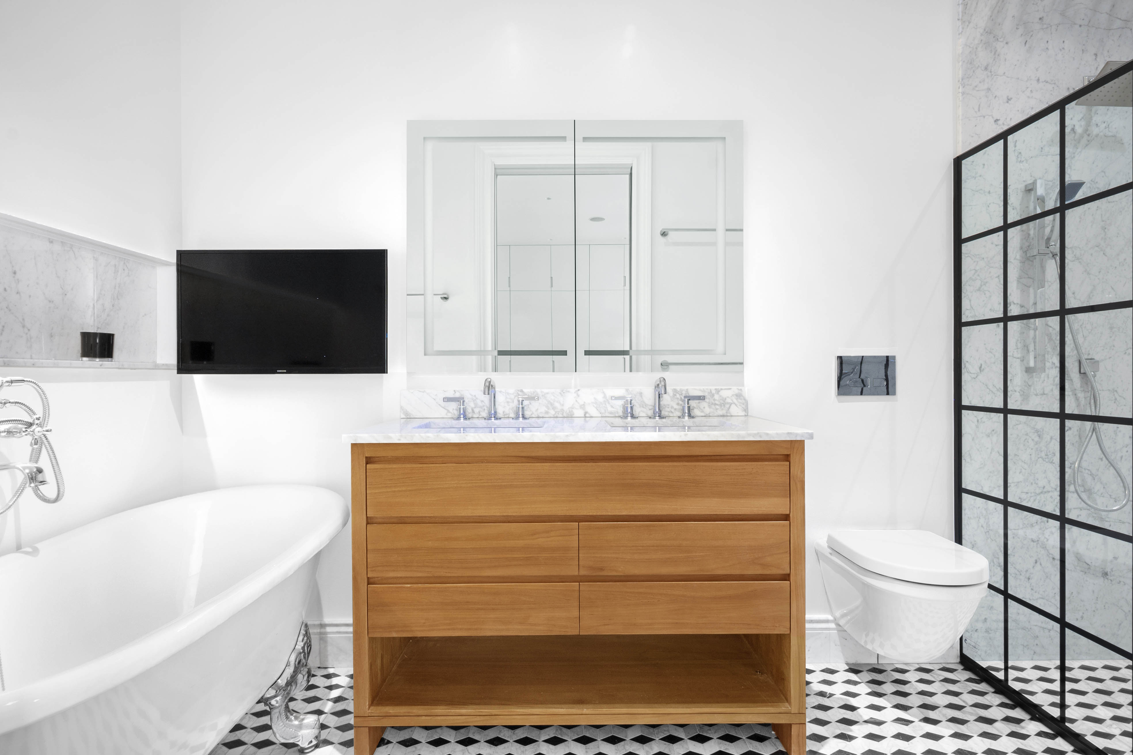 33 West 67th Street, Unit 4M Manhattan, NY 10023 - Photo 10 of 16 a bathroom with a sink a toilet and a bathtub