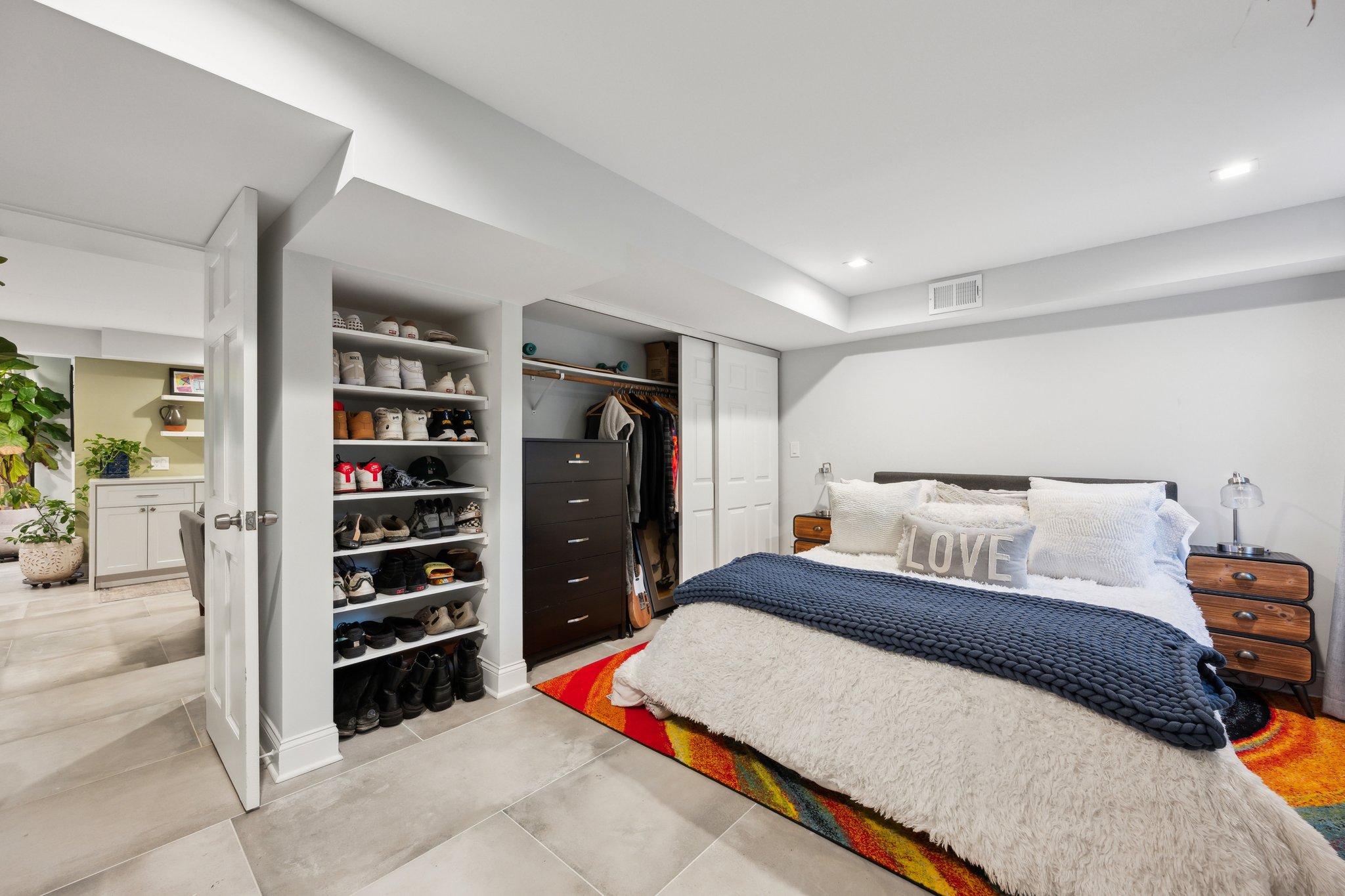 2607 Ross Road Chevy Chase, MD 20815 - Photo 28 of 37 a bedroom with a bed a dresser and book shelf