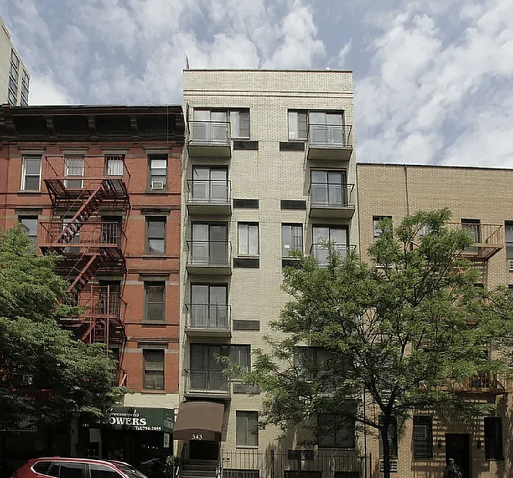 343 East 76th Street, Unit 5D Manhattan, NY 10021 - Photo 6 of 7 a front view of a building with balcony