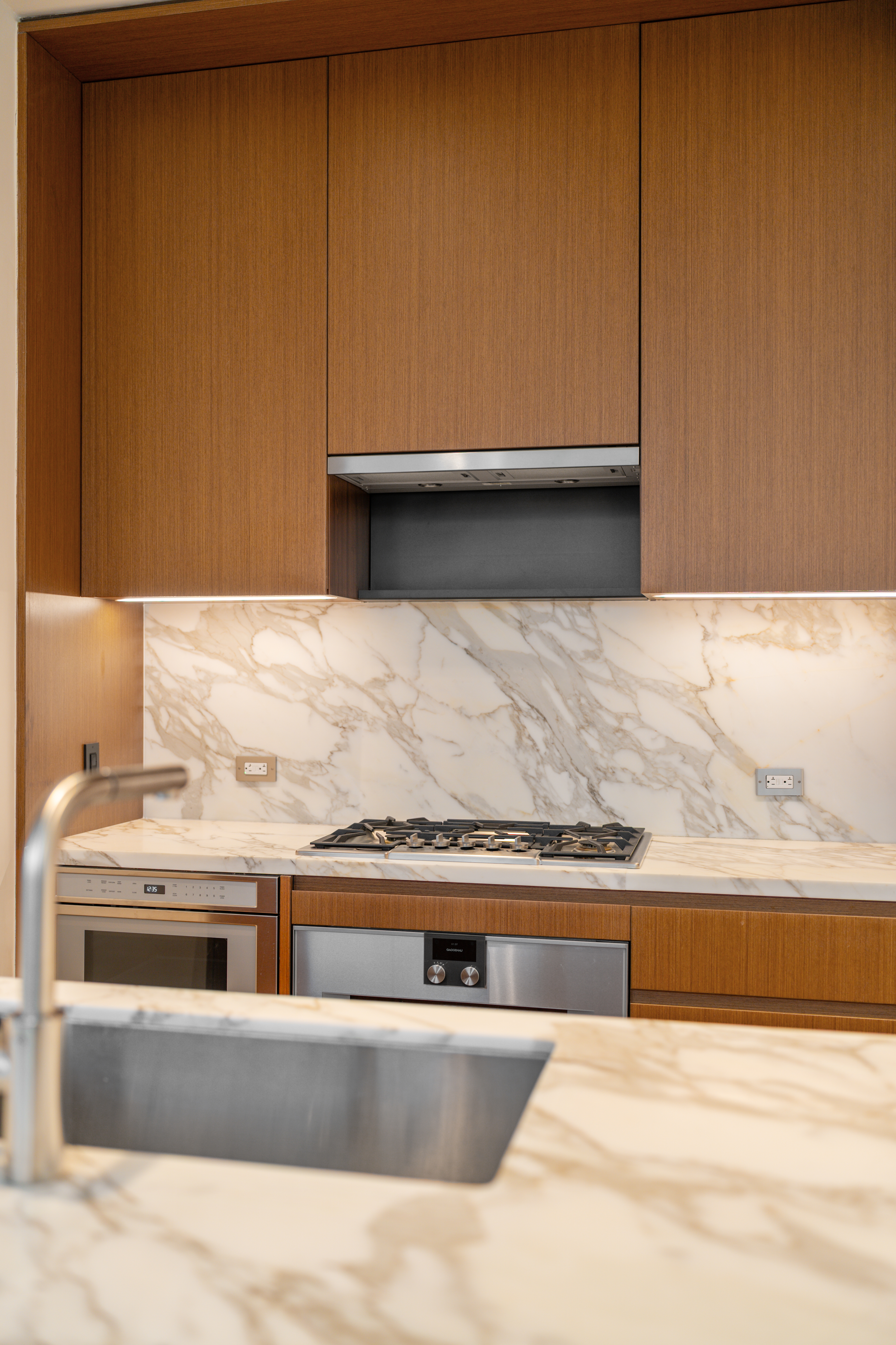 15 East 30th Street, Unit 19B Manhattan, NY 10016 - Photo 17 of 40 a view of kitchen with wooden floor