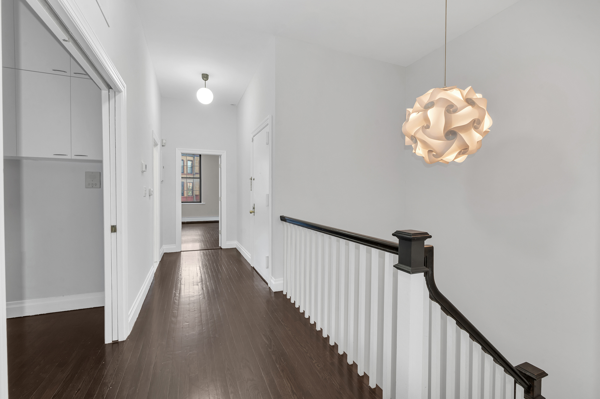 710 St Nicholas Avenue, Unit 2 Manhattan, NY 10031 - Photo 9 of 12 a view of a hallway with wooden floor