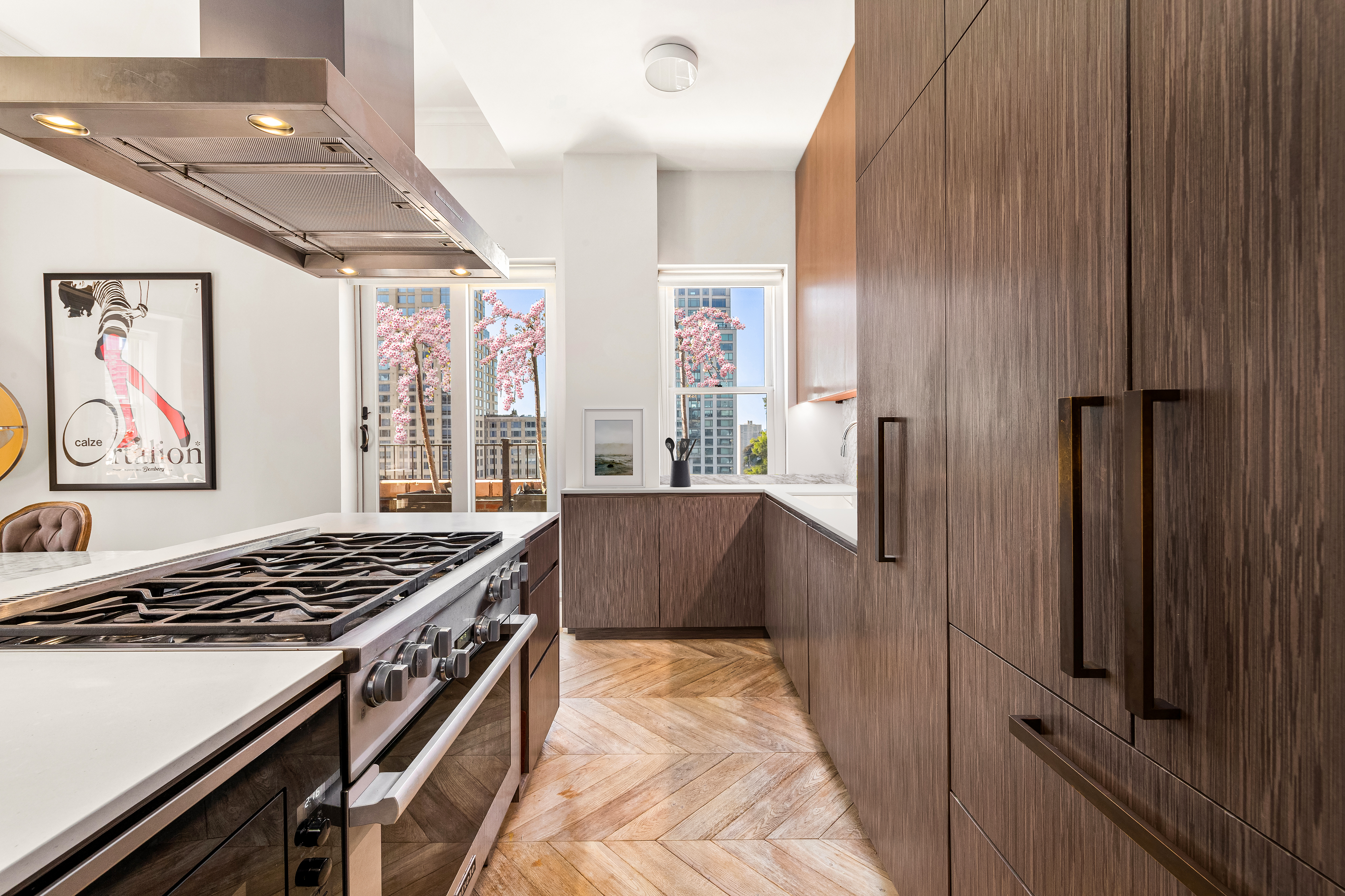 243 West End Avenue, Unit PH Manhattan, NY 10023 - Photo 4 of 11 a kitchen with stainless steel appliances granite countertop a stove and a refrigerator