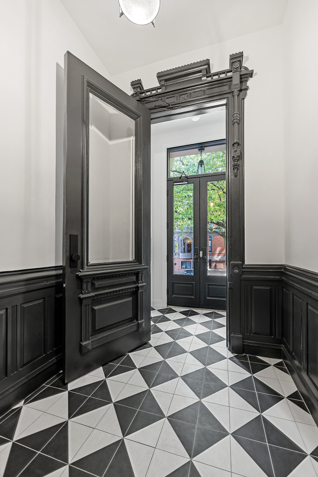 84 6th Avenue, Unit 1 Brooklyn, NY 11217 - Photo 18 of 22 a view of a entryway door with a rug