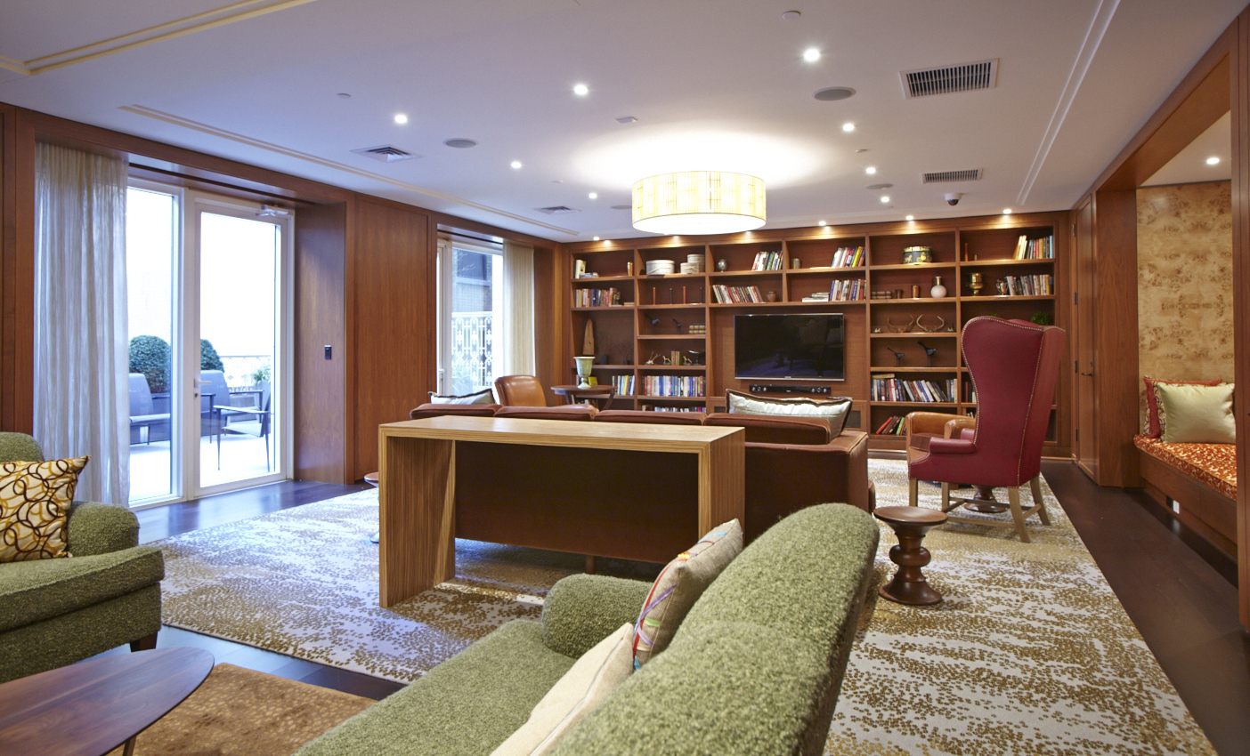 2150 Broadway, Unit 9E Manhattan, NY 10023 - Photo 11 of 14 a living room with furniture a rug and a flat screen tv
