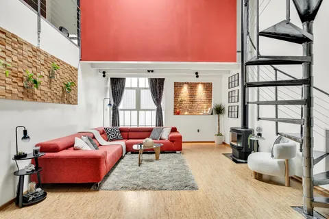 a living room with furniture or couch and a window