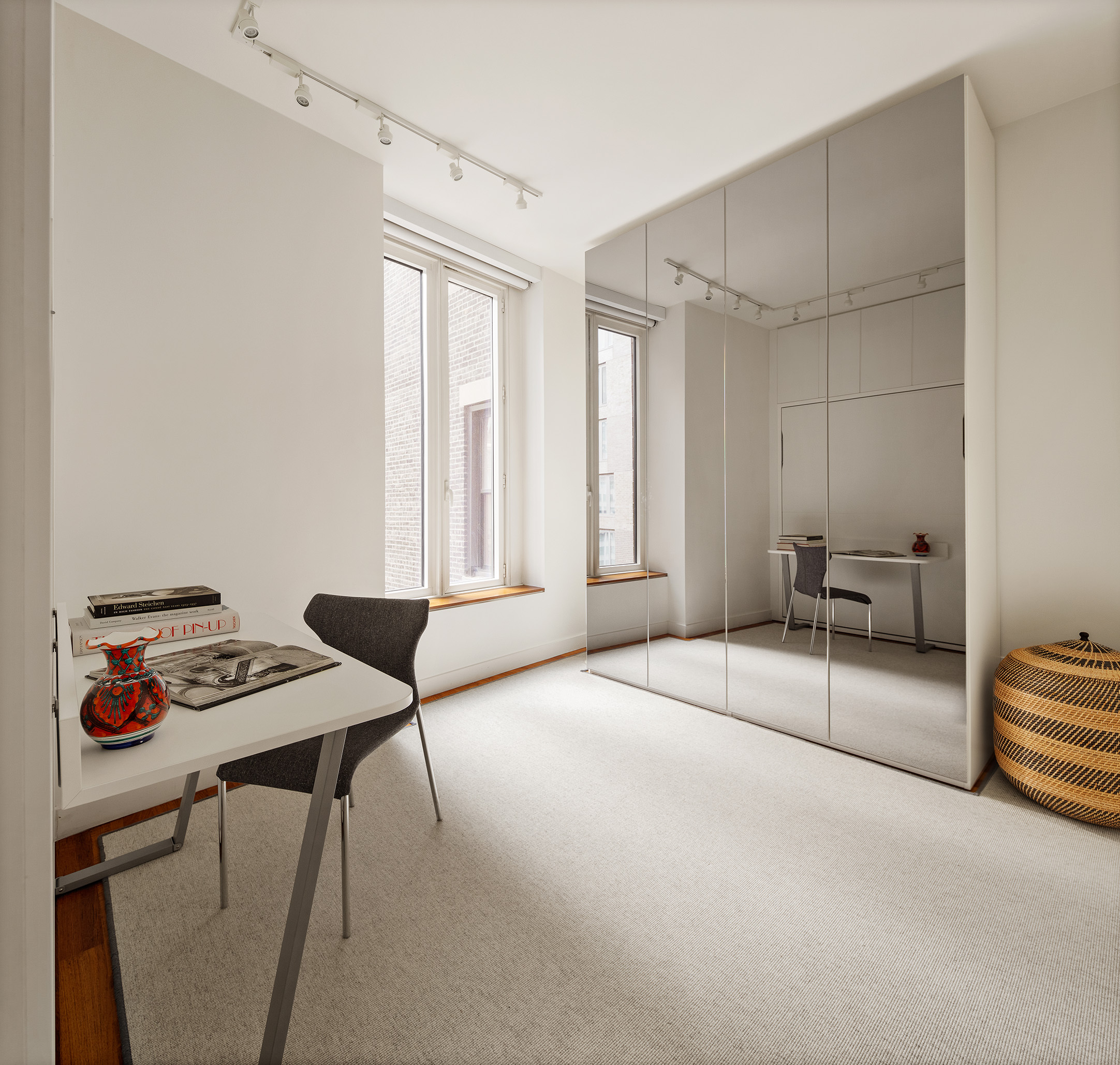 15 William Street, Unit 22H Manhattan, NY 10005 - Photo 10 of 20 a bedroom with furniture and white walls