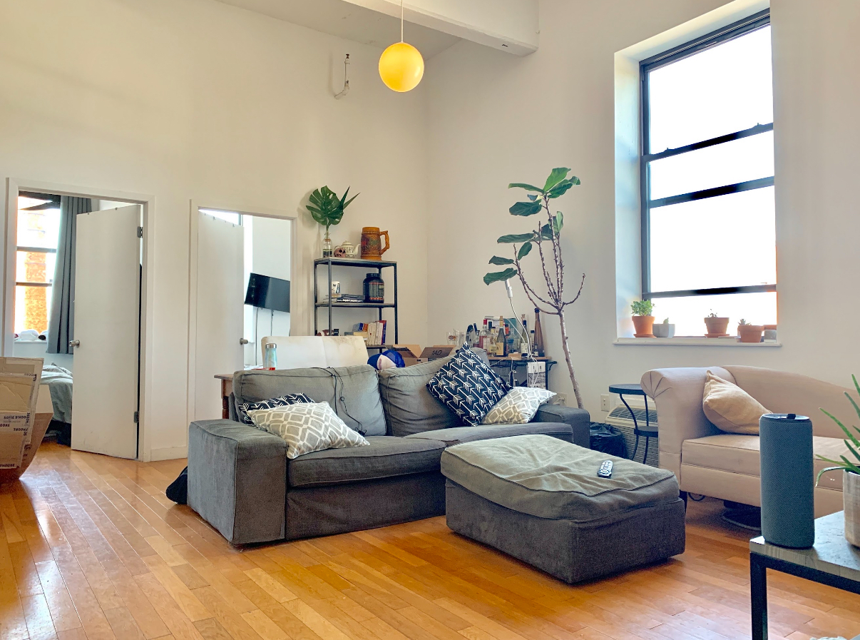 a living room with furniture and a window