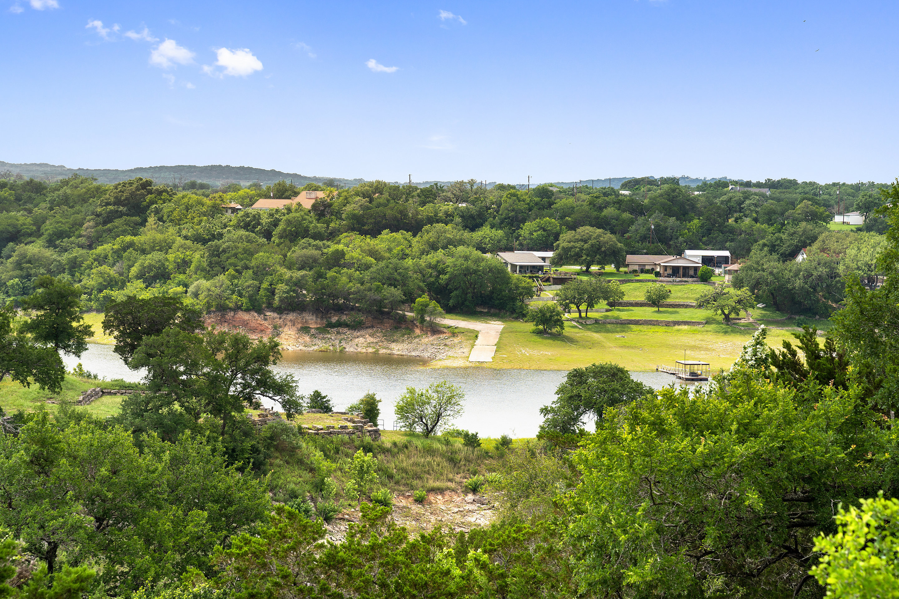 808 Rivercliff Drive Spicewood, TX 78669 - Photo 66 of 71 a view of a lake with a mountain