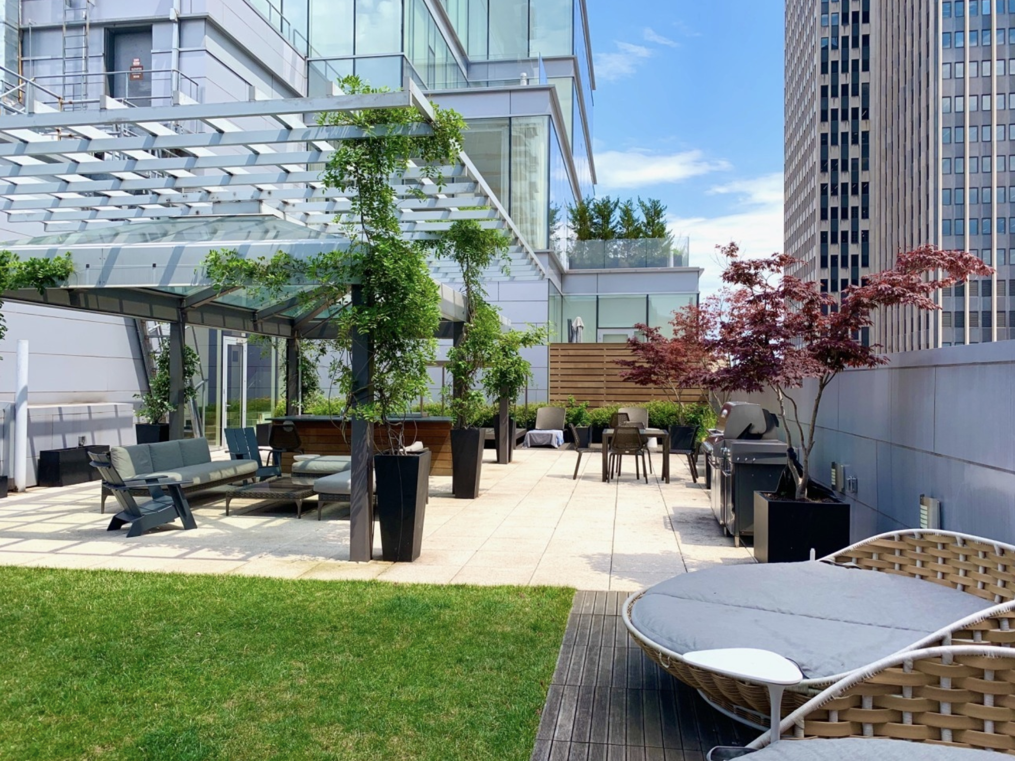 93 Worth Street, Unit 1006 Manhattan, NY 10013 - Photo 17 of 18 a swimming pool with outdoor seating and yard in the back