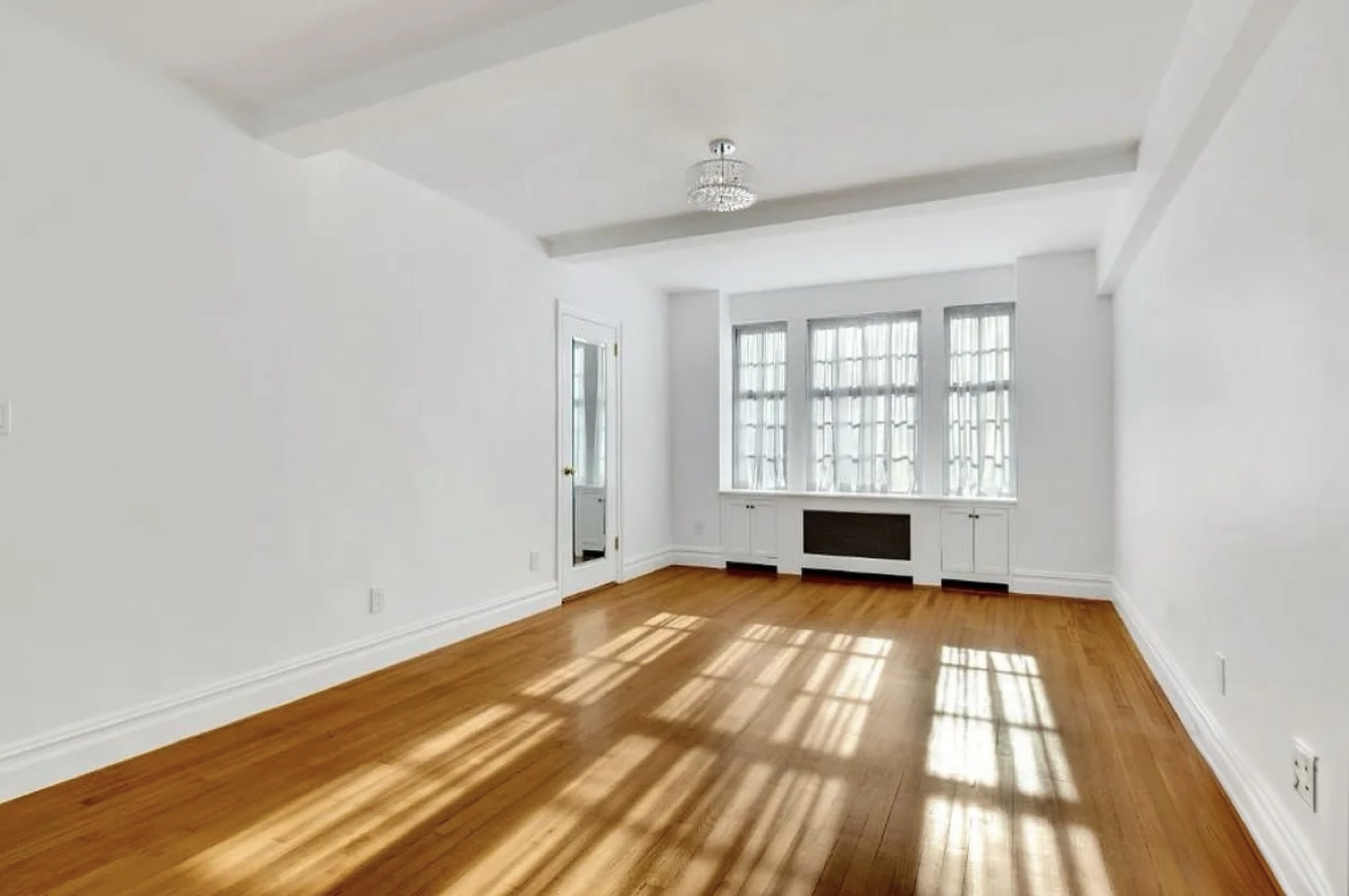 230 East 50th Street, Unit 3B Manhattan, NY 10022 - Photo 13 of 21 a view of an empty room with a window
