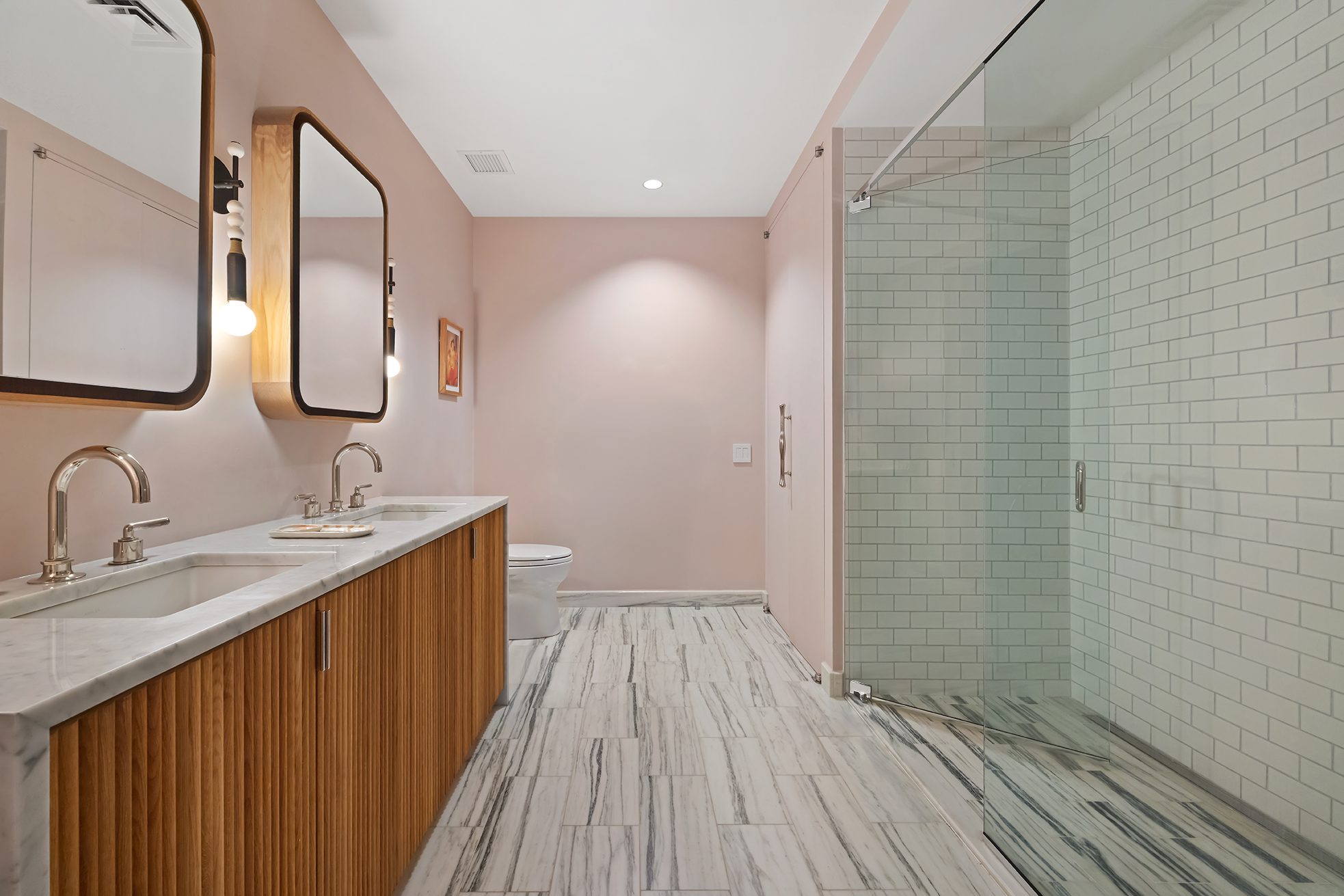 63 Greene Street, Unit PHB Manhattan, NY 10012 - Photo 14 of 17 a bathroom with a sink and a mirror