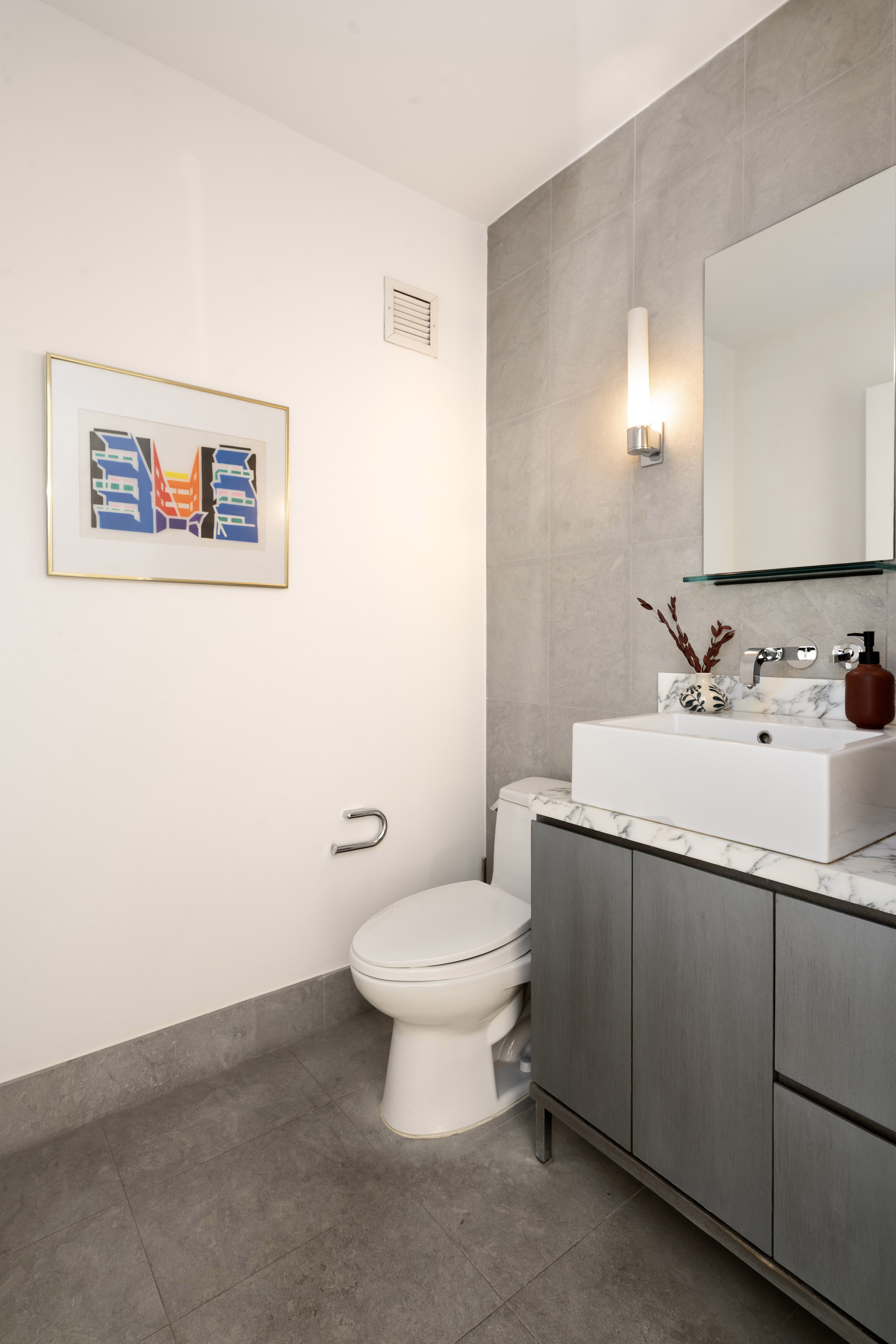 360 Furman Street, Unit 1041/1042 Brooklyn, NY 11201 - Photo 8 of 30 a bathroom with a toilet sink and mirror