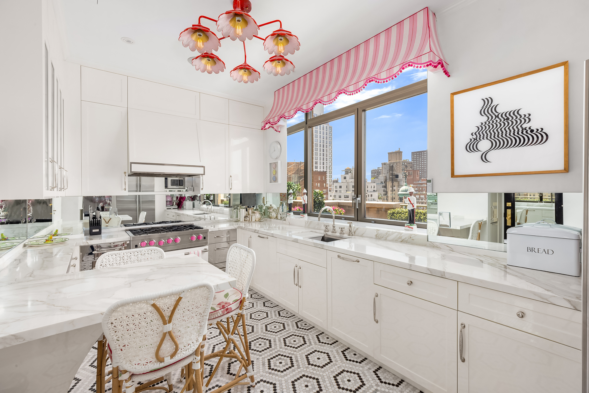 145 East 76th Street, Unit PH Manhattan, NY 10021 - Photo 11 of 25 a kitchen with a sink a stove and cabinets