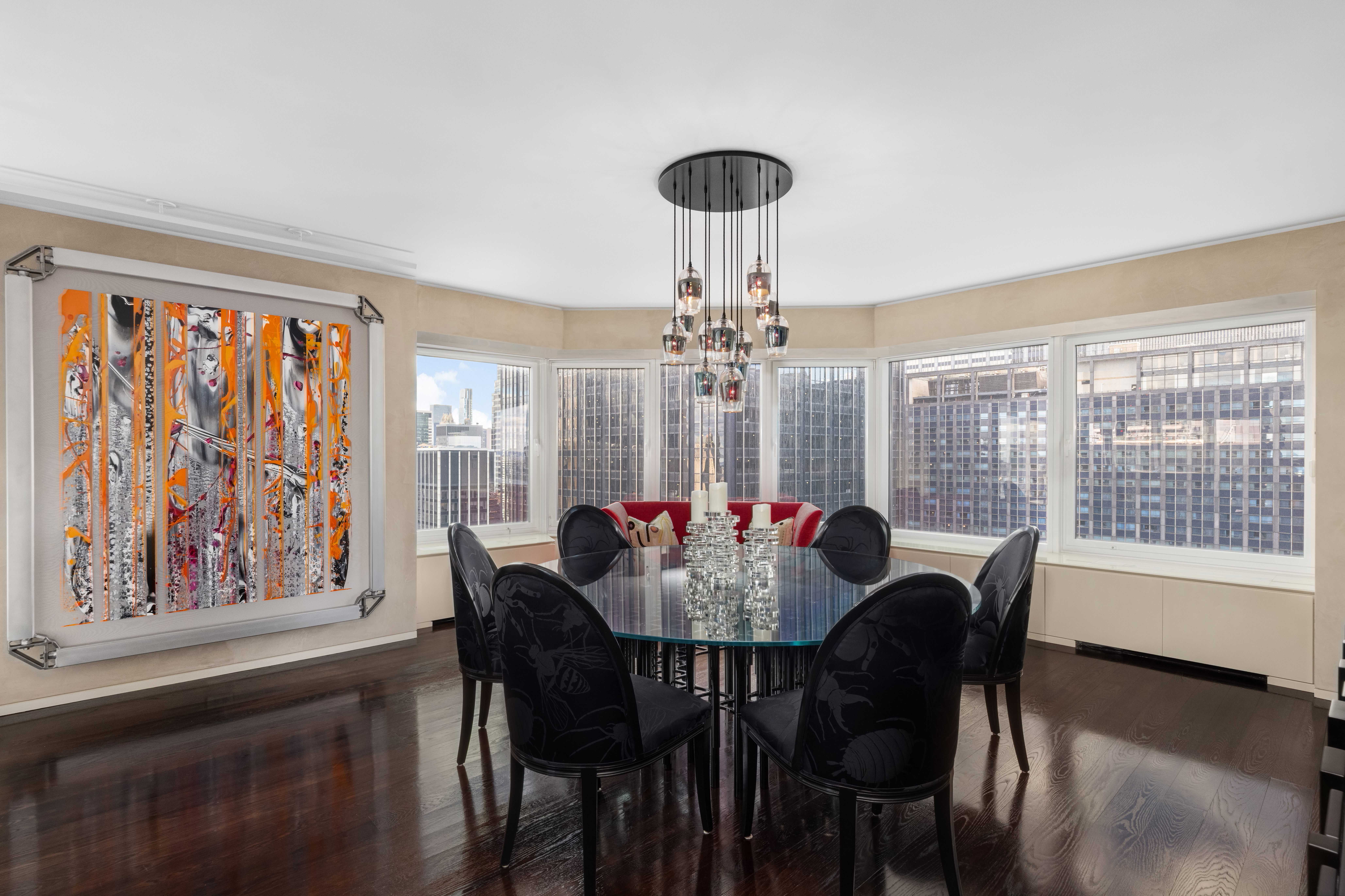 150 West 56th Street, Unit 3901 Manhattan, NY 10019 - Photo 4 of 25 a view of a dining room with furniture window and wooden floor