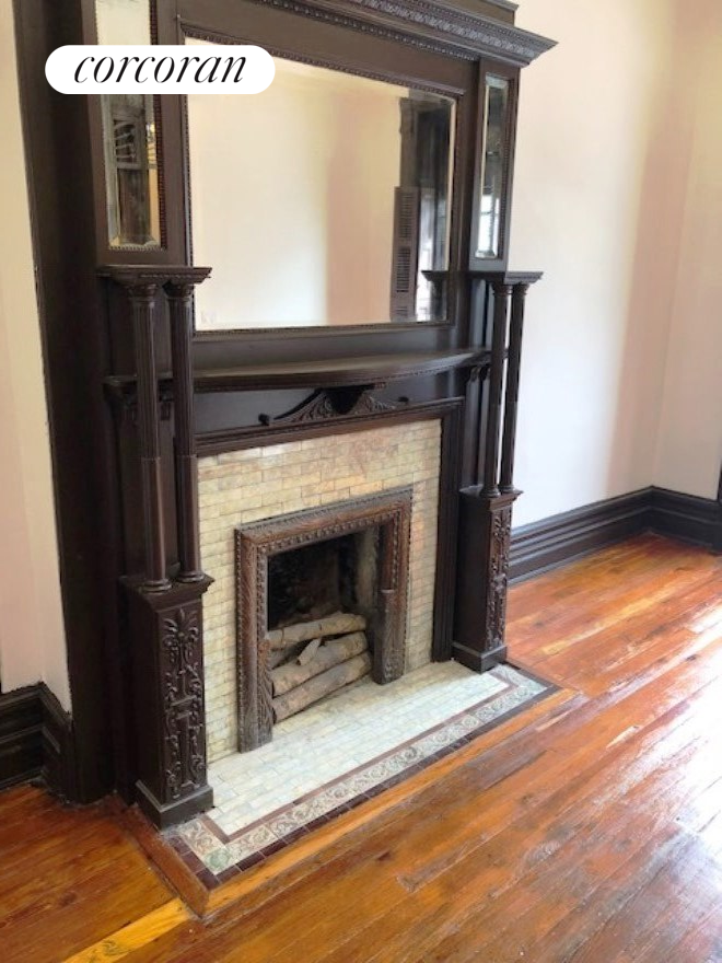 493 Decatur Street, Unit 1 Brooklyn, NY 11233 - Photo 7 of 26 a view of living room with furniture and a fireplace