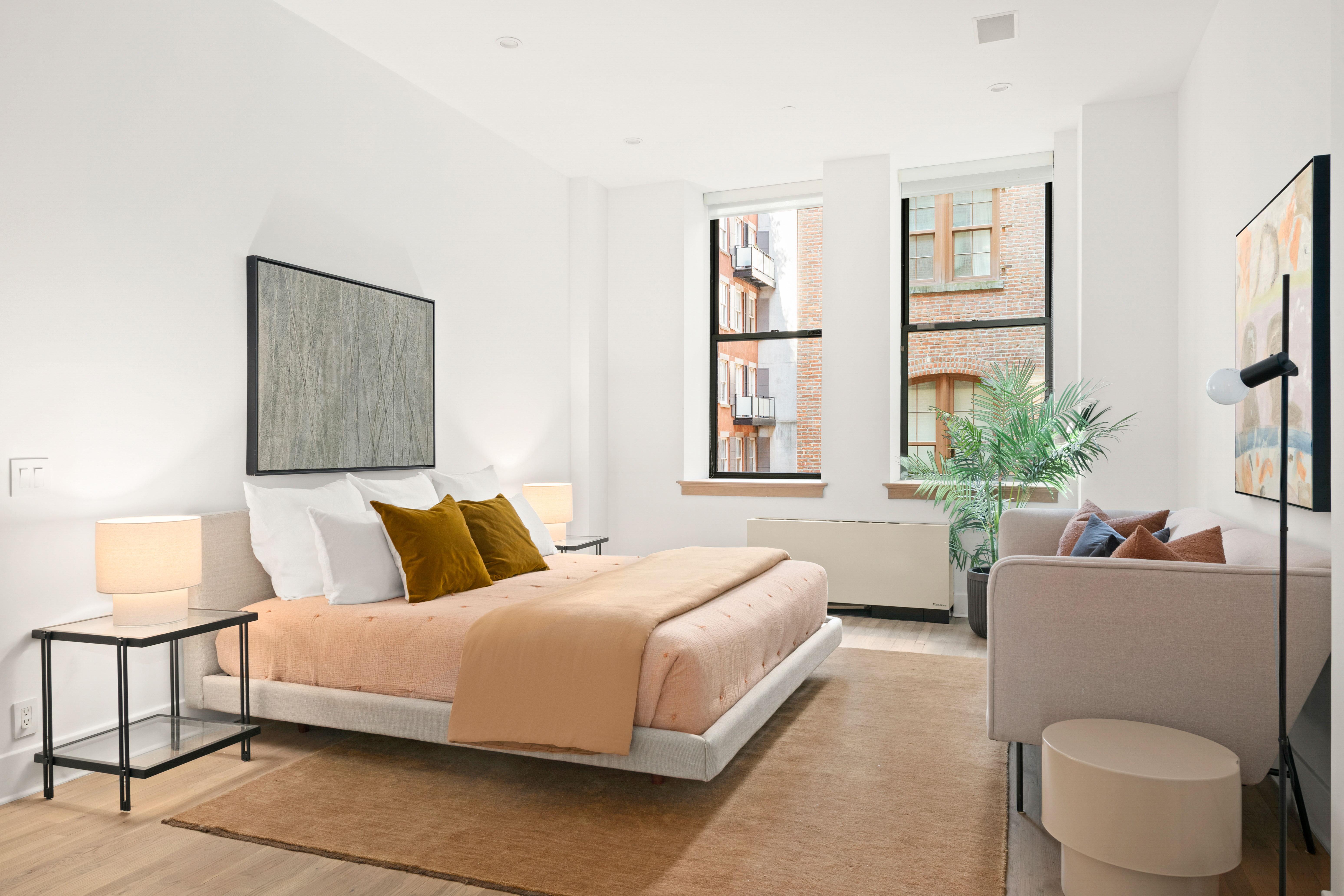 53 North Moore Street, Unit 2F East Manhattan, NY 10013 - Photo 7 of 12 a bedroom with a bed and a couch