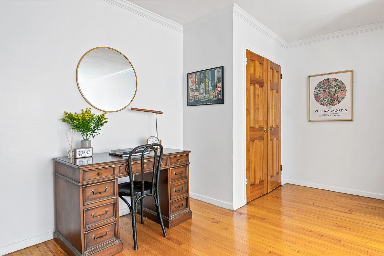 a view of a workspace room with furniture and wooden floor
