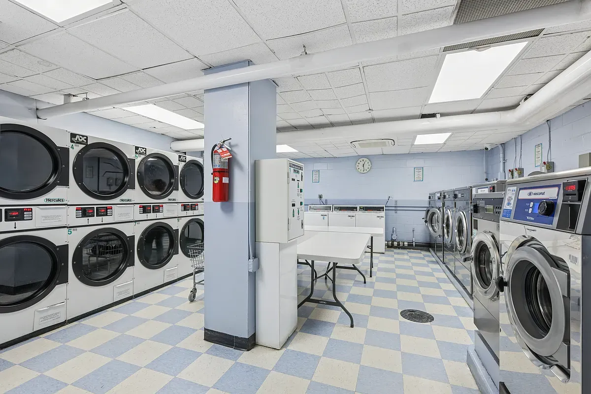 a utility room with sink dryer and washer